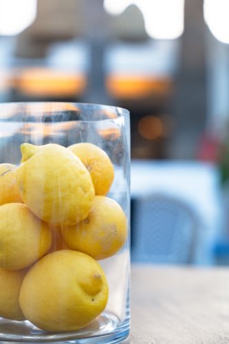A bowl of lemons on the table